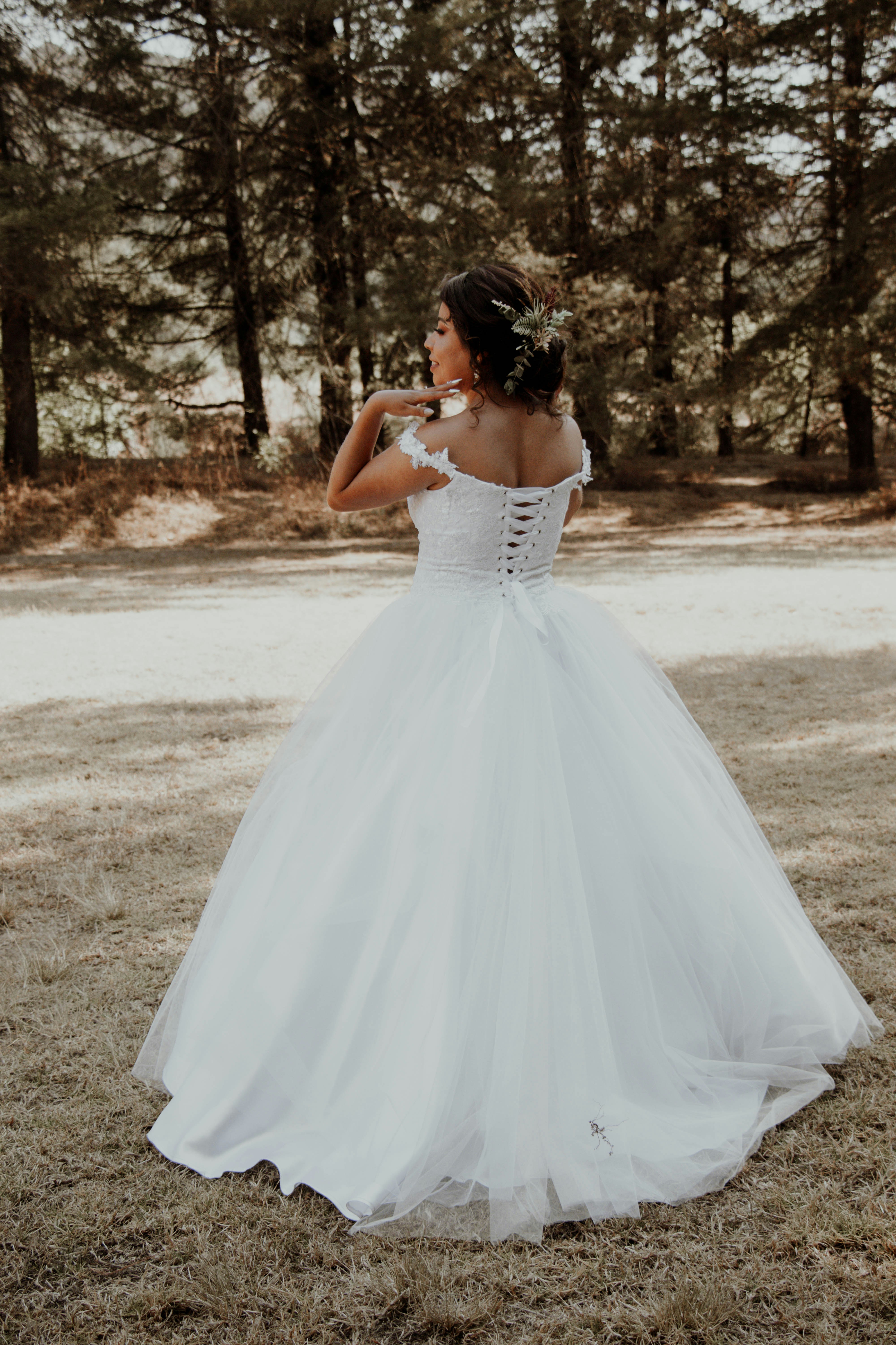 Groom kissing his bride as her sheer veil drifts across them